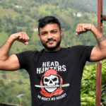 100% cotton double bio-washed custom t-shirt with "HEAD HUNTERS – No Mercy No Regret" skull design on front and personalized name with rifle print on back.